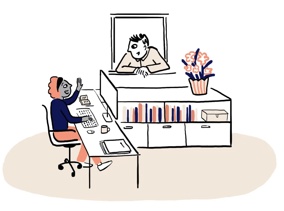 Someone at their desk waving to a colleague